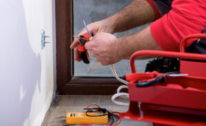 installing-plugs-by-a-residential-electrician-professional-photo