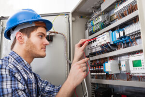 photo of a professional electrician fixing cable wires
